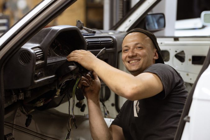 Automotive mechanic doing repairs and maintenance.